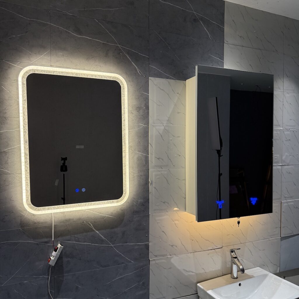 Elegant lighted mirrors and cabinet