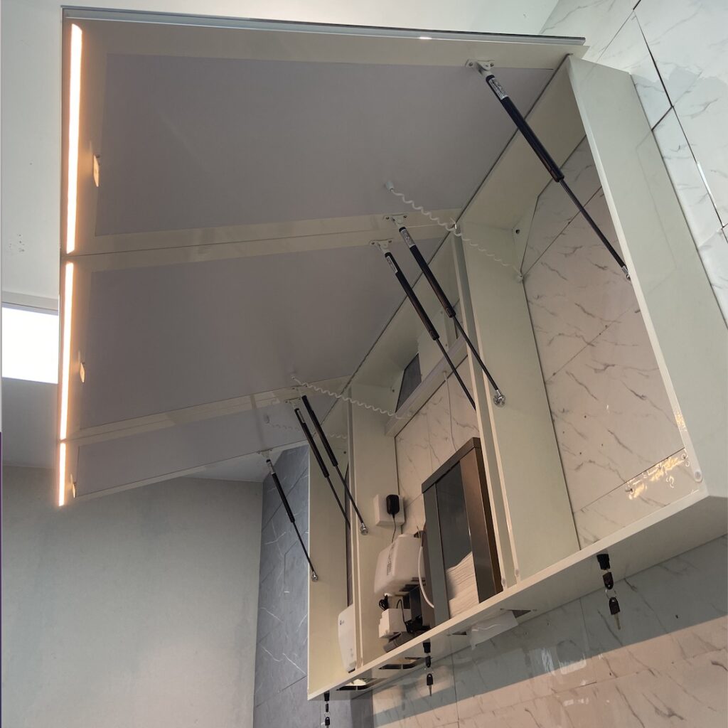 Mirror cabinet with soap dispenser
